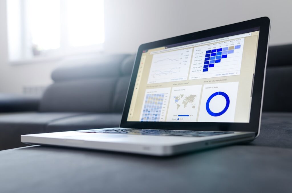 Laptop placed in a chair displaying tracking and analyzing proposal performance for continuous improvement