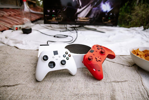 ALT text: gaming controllers and console setup